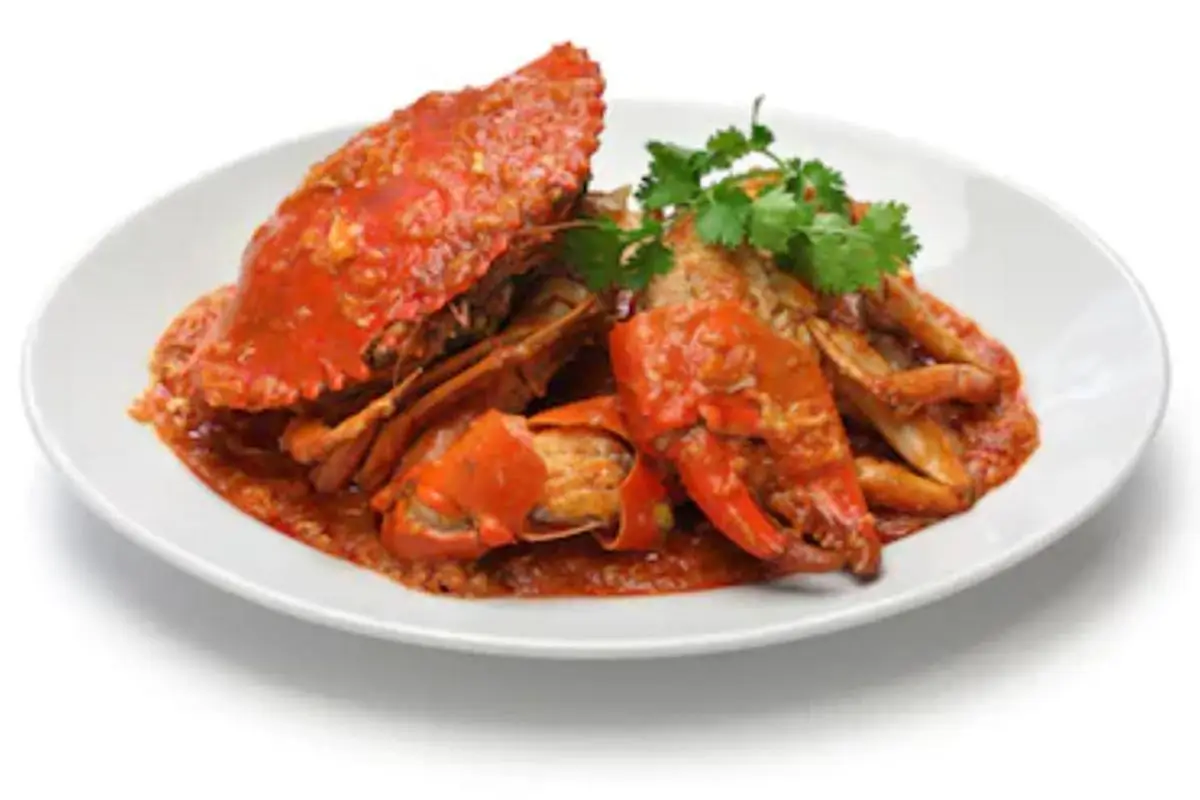 Singapore Chili Crabs, a popular Singaporean dish. The crabs are cooked in a thick, vibrant red chili sauce. The sauce is a mix of tomato, chili, and various spices.