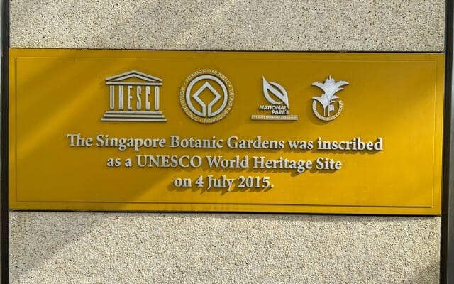 Plaque commemorating the Singapore Botanic Gardens as a UNESCO World Heritage Site, marked on 4 July 2015. The plaque features the UNESCO logo, National Parks Board insignia, and an image of the garden's iconic orchid.