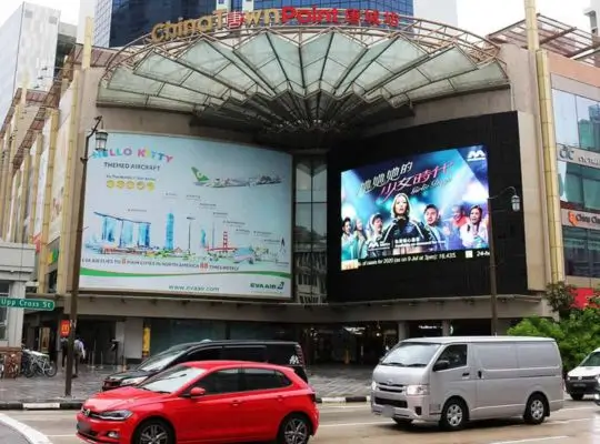 Chinatown Point shopping mall in Singapore, featuring a distinctive fan-shaped glass canopy above its entrance. Credits to Chinatown.sg