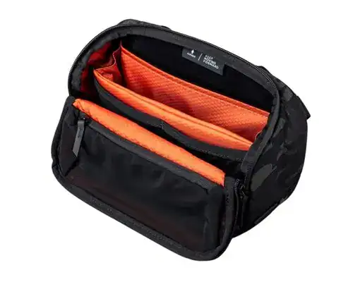 Alpaka Vertex Pouch-Black EDC sling bag with an unzipped main compartment, revealing a bright orange lining and padded dividers for organized storage. The front pocket includes a mesh pouch for tech gear or essentials.