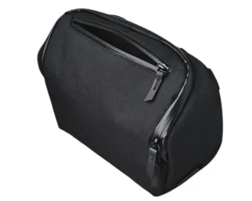Alpaka Vertex Pouch-Black EDC sling bag with a sleek, minimalist design and weather-resistant zippers for the front and main compartments. Its compact, structured shape is ideal for everyday essentials.